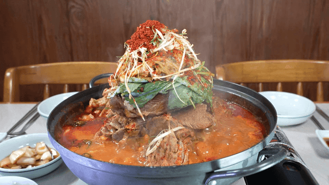 Spicy pork backbone stew boiling in pot