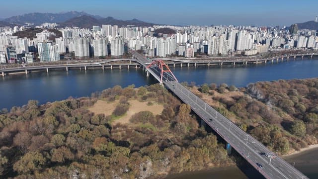 Bamseom Islet under the Bridge in Hangang River and Urban Cityscape