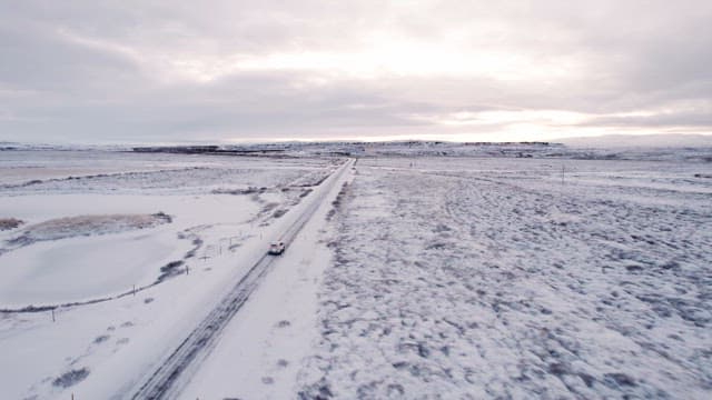 Car driving on a snowy road