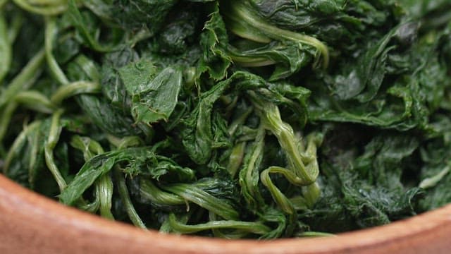 Freshly Boiled korean thistle in a Wooden Bowl