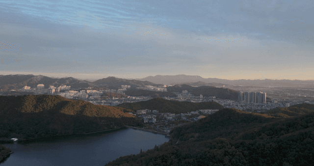 City surrounded by mountains at evening