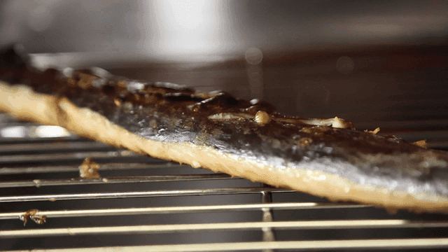 Grilled Spanish mackerel being baked in oven