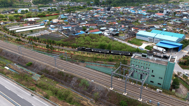 Train passing through a rural village