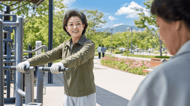 Elderly woman exercising in park