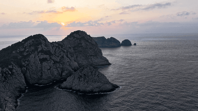 Rocky islands at sunrise with calm sea