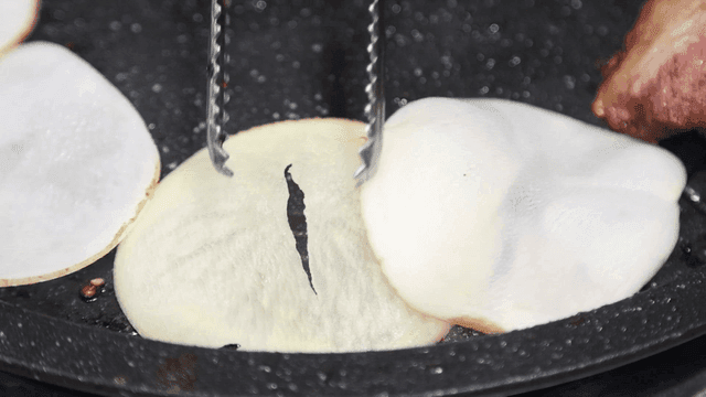 Potato slices roasted in pan