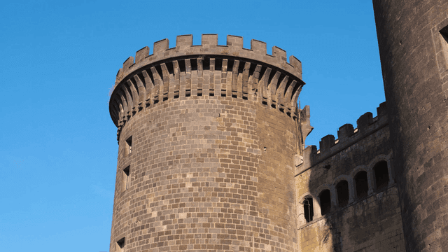 Historic stone tower under a clear sky
