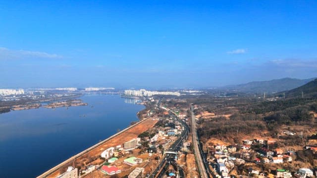 Riverside City Scenery Under a Clear Blue Sky