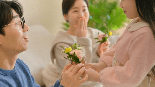 Parents who are happy to receive carnations given by their children