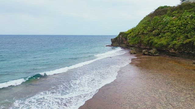 Waves gently rolling on a serene beach