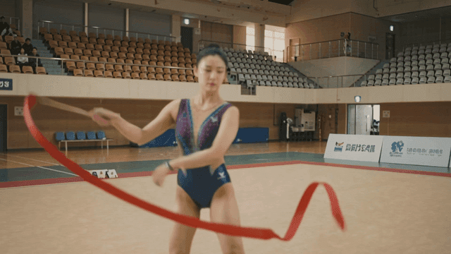 Rhythmic gymnast performing with ribbon