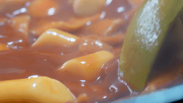 Spicy tteokbokki boiling in pot
