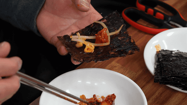 Spicy steamed fish, bean sprouts, and octopus served on seaweed