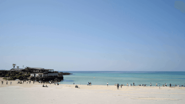 Sunny, sandy beach where people relax