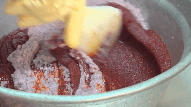 Mixing ingredients in a large pot