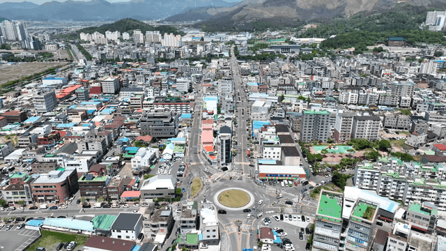 Bustling city with surrounding mountains