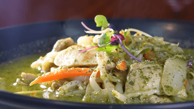 Jjamppong dish with vegetables and basil in sauce