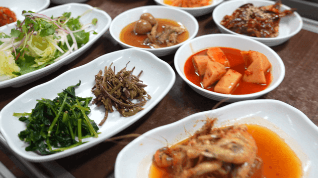 Various Korean side dishes on a table
