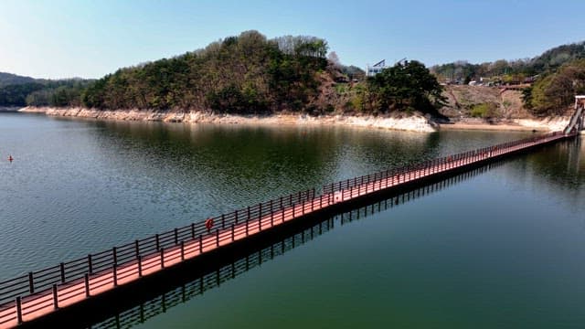 Scenic lake with a long walkway