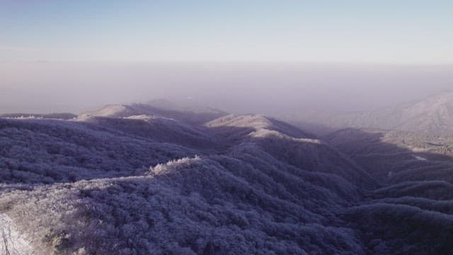 Mountains Covered White with Snow at Dawn