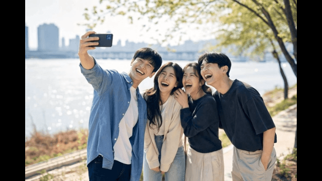 Friends taking a selfie by the river