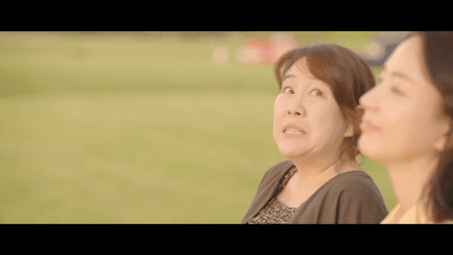 Two women having a conversation outdoors