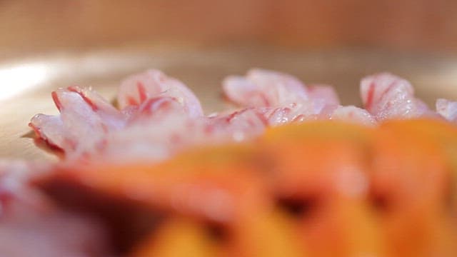 Sliced fish and liver of it on a plate