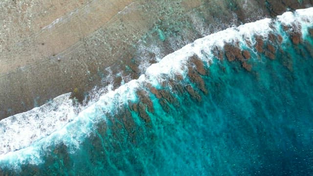 Waves Crashing on Shore with Many Rocks