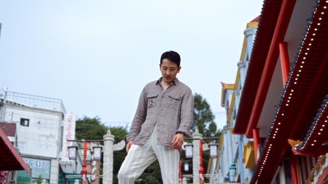 Man sitting on colorful steps