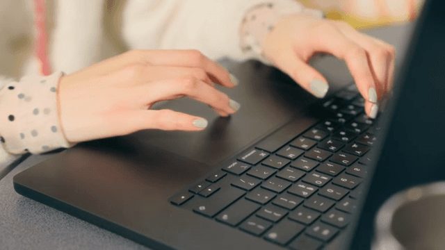 Woman working on a laptop indoors