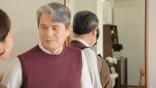 Elderly couple smiling indoors