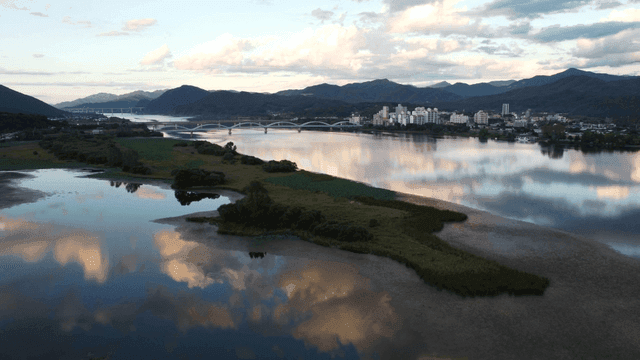 Tranquil river reflecting sky