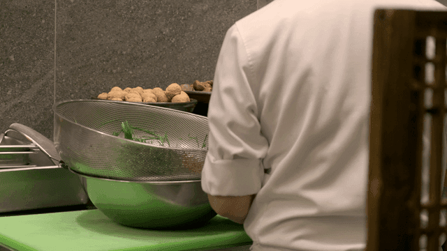 Chef preparing ingredients in a kitchen