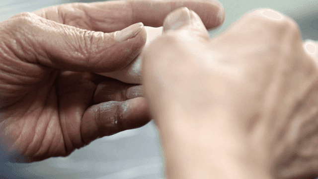 Hands making dumpling dough in kitchen
