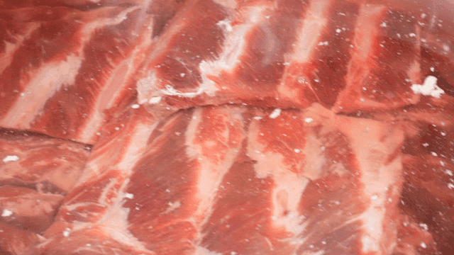 Raw meat soaking in water
