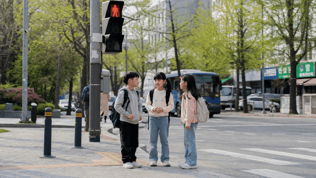 Children talking at crosswalk