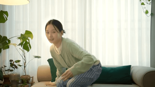 Woman runs out of sofa while using her smartphone.