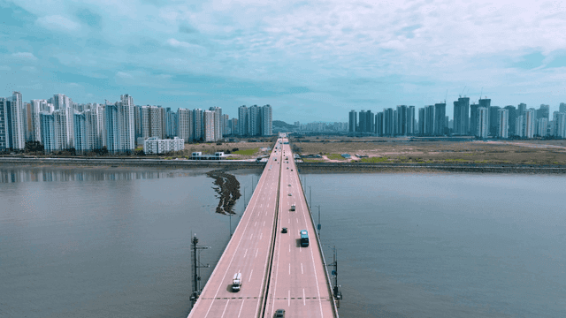 Bridge leading to city skyline