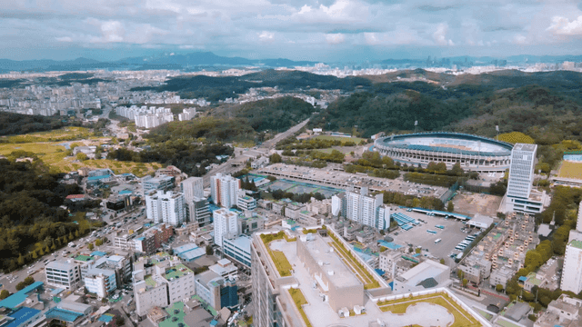 Aerial view of a city with a stadium