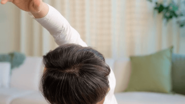 Woman stretching in a cozy living room