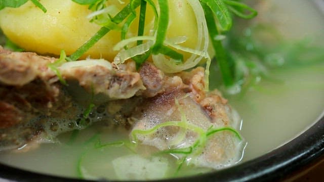 Braised pork backbone with clear soup in an hot pot