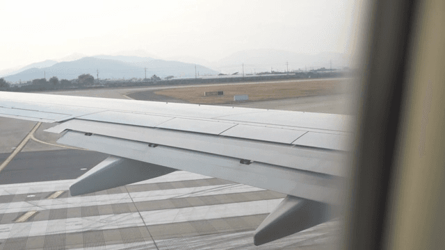 Airplane wing during taxi on runway