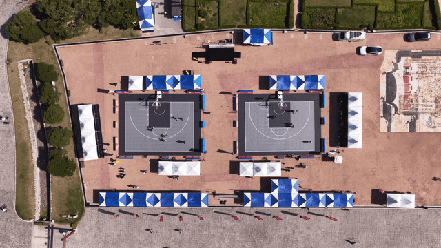 Outdoor basketball courts with players