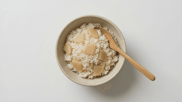Bowl of rice with pieces of radish