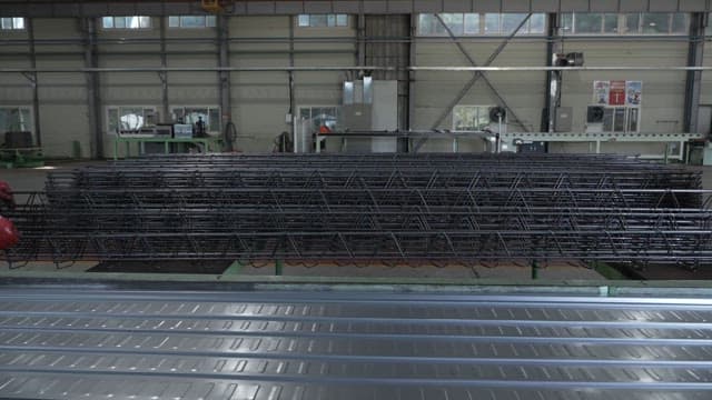 Metal structures being processed in a factory