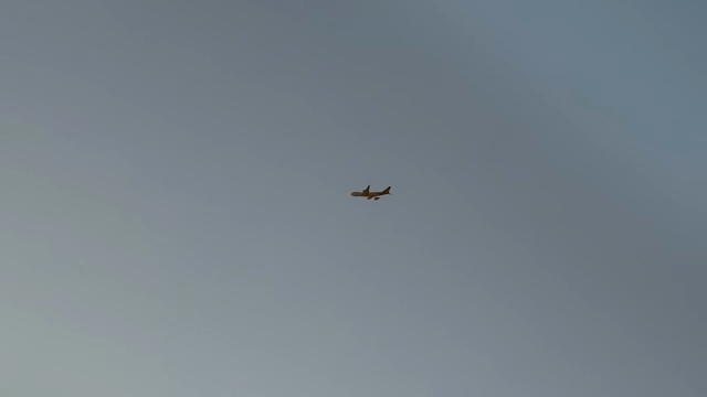 Airplane flying in the clear blue sky