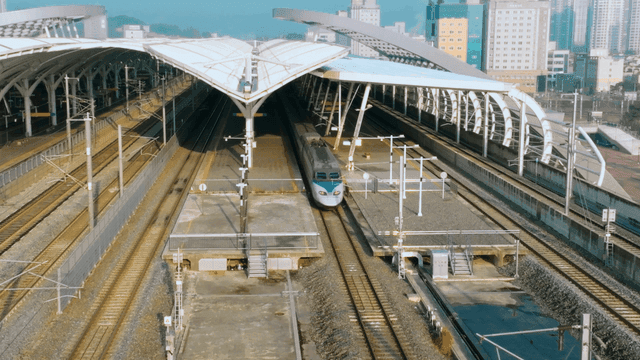 High-speed train arriving at modern station