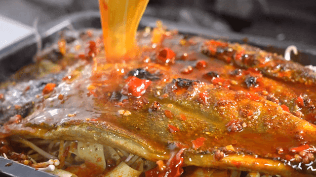 Mala Kaoyu, grilled fish with spicy mala sauce poured over it.