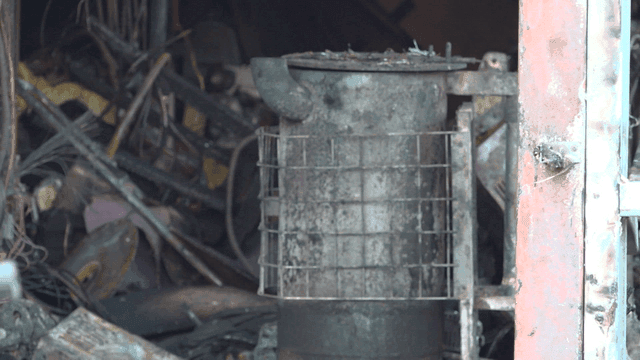 Rusty heater in messy workshop destroyed by fire