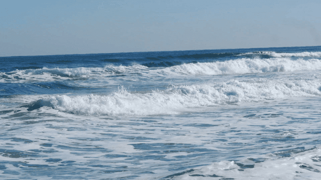 Waves crashing on a serene beach